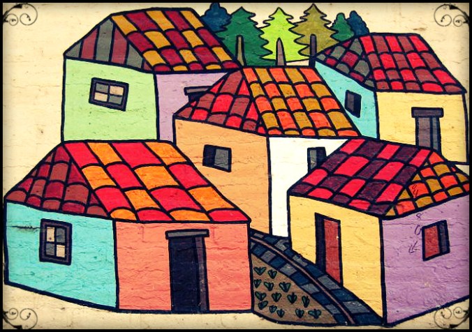 Mural with different colored houses in La Palma, El Salvador