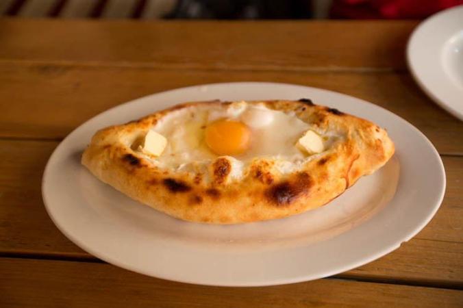 Khachapuri cheese with bread and eggs