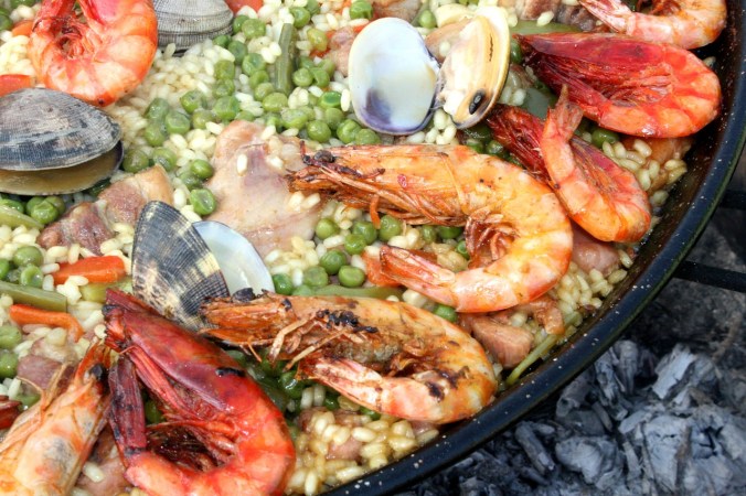 Love seafood? Then you must tantalize your tastebuds with the one and only Paella, a typical feast in Spain and around the world. Rice is cooked with all types of seafood and is delicious.