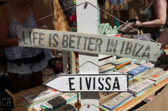Life is better in Ibiza or Eivissa. Wooden signs on sale at a local store.