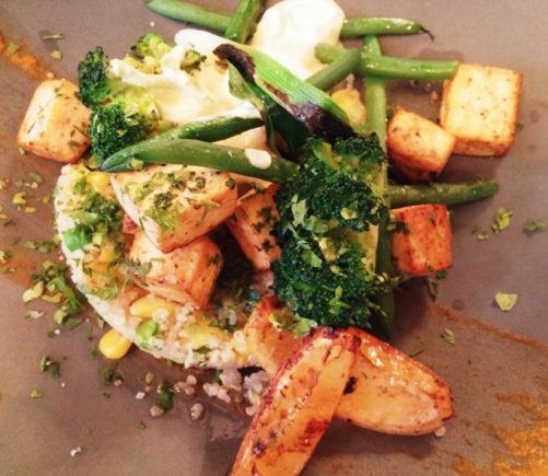 Quinoa, fried tofu and orange sauce topped with grilled green beans, asparagus and chopped parsley at Auberge Saint-Gabriel in Old Montreal.