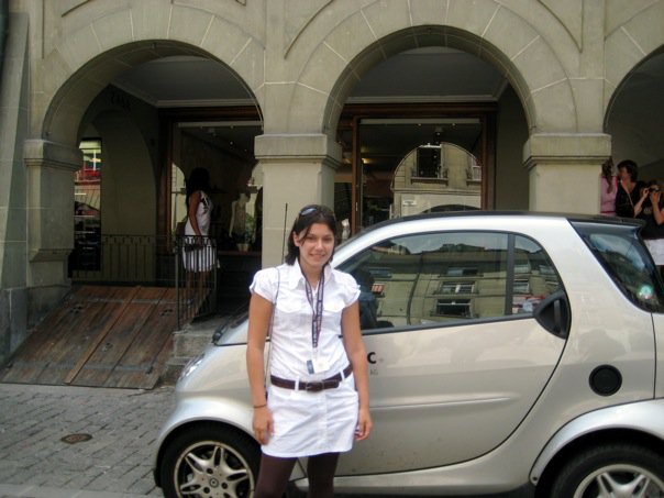 Posing with a Smart Car in Europe. Laura Vaisman, author of Spiritual Nomad book. #travel #photography #travelphotography